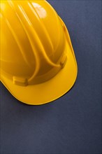 Close-up of a yellow helmet on a black background