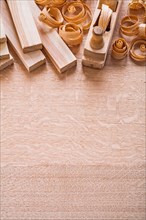 Copyspace image wooden boards woodworker planer and shavings construction concept