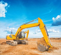 Excavator on construction site and sky background