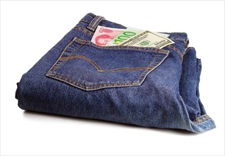 Money bills on pocket of a pair of blue jeans