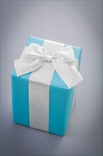 Blue giftbox on gray background