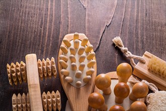 Classic wooden massager on an old wooden board
