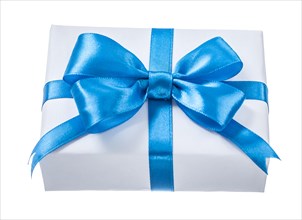 Wrapped white present box with blue knot isolated on white