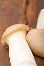 Bunch of fresh wild mushrooms on a rustic wood table