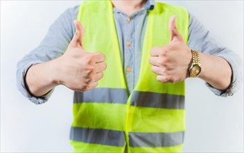Engineer hands with thumbs up in approval gesture isolated. Engineer thumbs up in approval gesture on isolated background