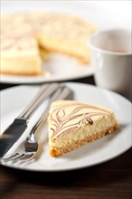 Fresh baked classic Cheese cake with chocolate topping and espresso coffee