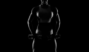 Black and white image of a sports girl on a black background. Fitness concept. Mixed media