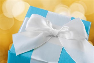 Blue gift box with white bow