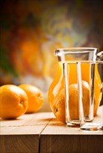Emrty glassware and oranges