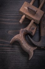 Composition of dark hand saw vintage marking gauge claw hammer
