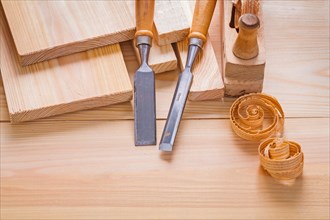 Composition of woodworking tools Carpenter's chisel and plane on wooden panels