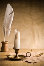Unlit candle on vintage table