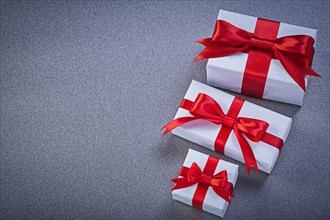 Assortment of gift boxes on grey background holidays concept