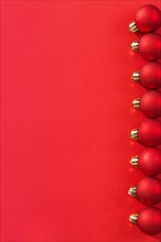 Copyspace image series of small red Christmas baubles