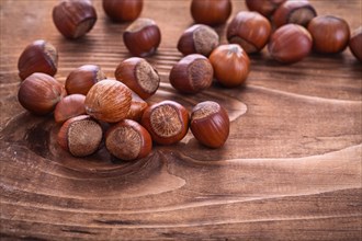 Hazelnuts on vintage wooden board Food and drink concept