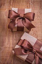 Brown vintage gift boxes on an old wooden board