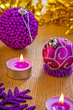Christmas composition of baubles and candles
