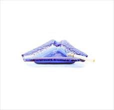 Blue murano glass ashtray with lighted cigarette isolated on white background