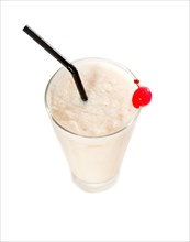 Frozen banana daiquiri drink cocktail with red cherry and black straw isolated on white background