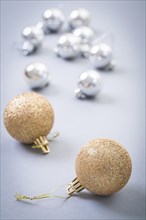 Christmas baubles on grey background