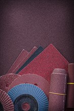 Heap of abrasive tools on polishing paper