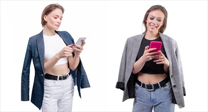 Portrait of two beautiful girls with mobile phones. White background.