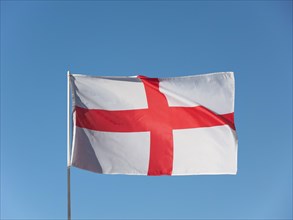 English Flag of England over blue sky