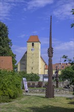 Church and wooden sculpture in the fortified village of Zumberk u Novych Hradu