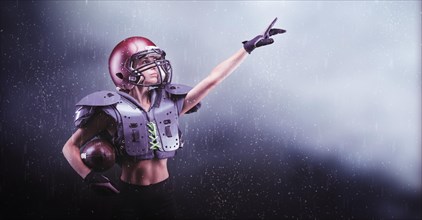 Brutal portrait of a girl in the uniform of an American football team player. Equipment advertising. Sports concept. Shoulder pads.