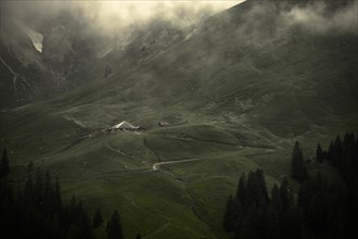 Alpine hut in a gloomy