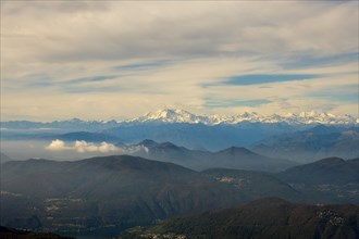 Aerial View over a Beautiful Mountainscape and And Snow Capped Monte Rosa and Mountain Peak Matterhorn and with Floating Clouds in a Sunny Day in Ticino