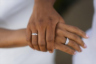 Hands of bride and groom with rings at a wedding