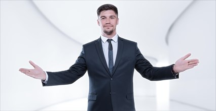 Image of a stylish man in a suit with open arms. Business concept.