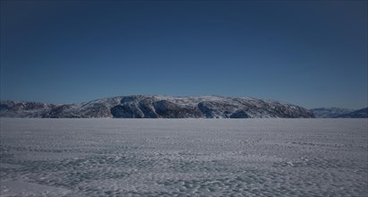 Hill on the shore of the icy fjord Kangerlussuaq