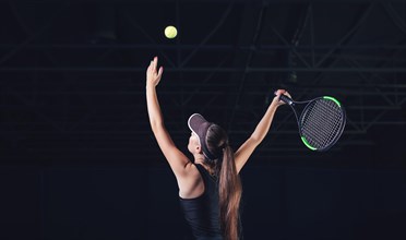 Portrait of a beautiful tennis player during a match. Sports concept.