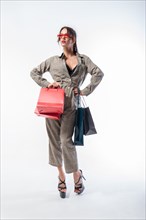 Stylish tall woman posing with packages. Concept for discounts