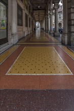 Floor mosaic in an arcade on Via XX Settembre