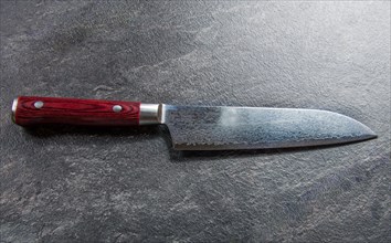 Excellent Japanese chef's knife from Damascus steel. View from above