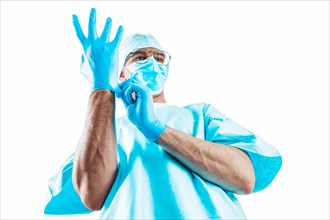 Portrait of a doctor on a white background. He pulls on the glove. Medicine concept.