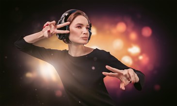 Image of a girl in a black dress with headphones in a nightclub. Party concept.