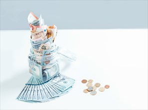 Glass jar full of money. Crisis Savings Concept.