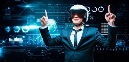 Portrait of a man in a suit and helmet. He is showing thumbs up against the background of a hologram of market trading. Business concept. Stock market. Brokers and traders.