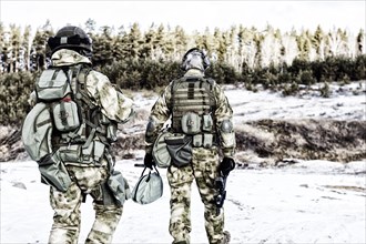 Two soldiers of a special unit are preparing to carry out a dangerous mission.