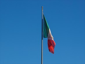 Italian flag over blue sky