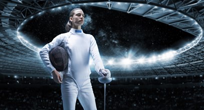Young girl posing on a stadium background. The concept of fencing.
