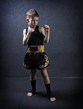 Portrait of a child in sports equipment. The concept of kickboxing