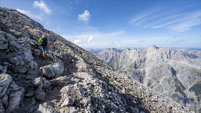 Mountaineer on rocky path to Watzmann Hocheck summit