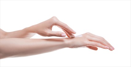Image of female hands applying cream to the skin. Medical concept of healthy skin and hand care.