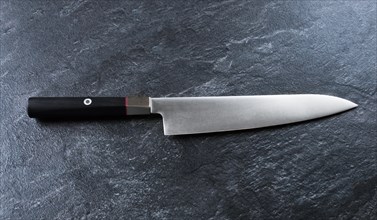 Chef's knife from Damascus steel. A real Japanese work of art. View from above