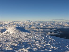 View from the summit of Cayambe volcano to the sea of clouds